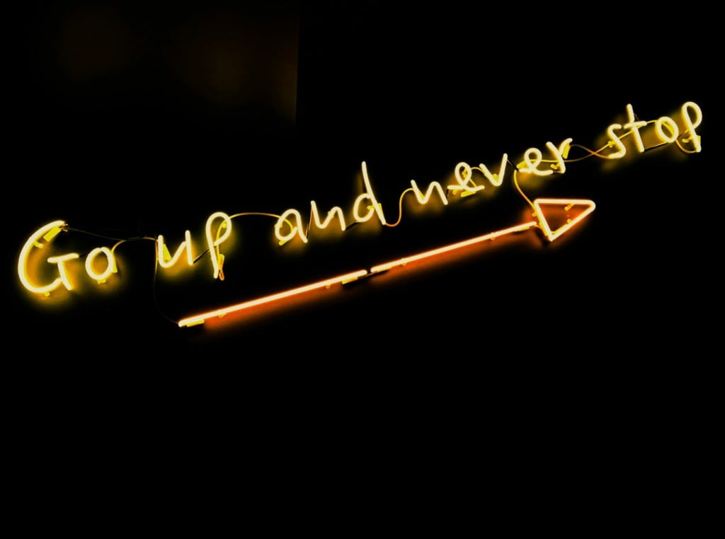 Neon text: go up and never stop